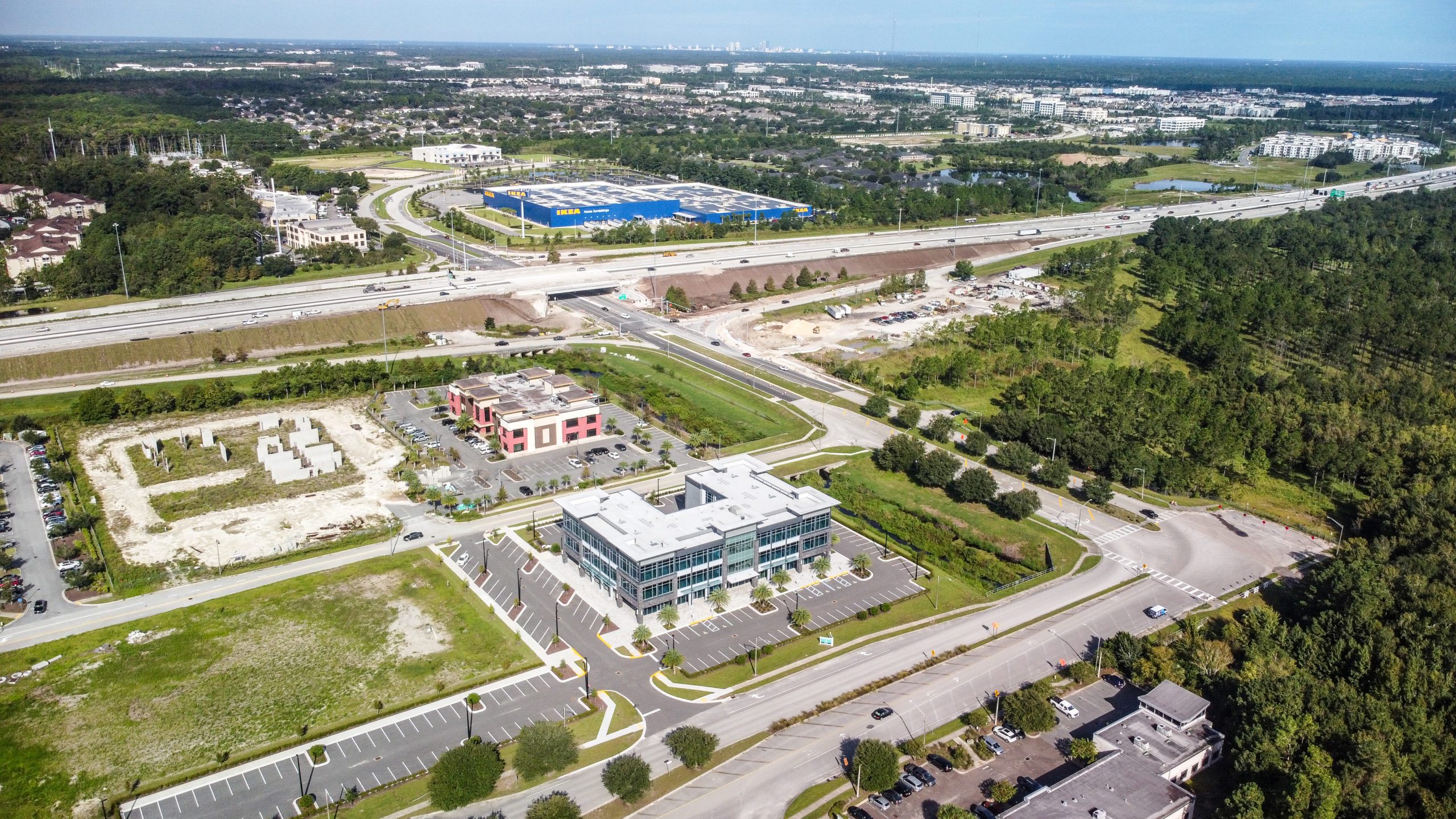 An aerial view of office buildings and surrounding highways.