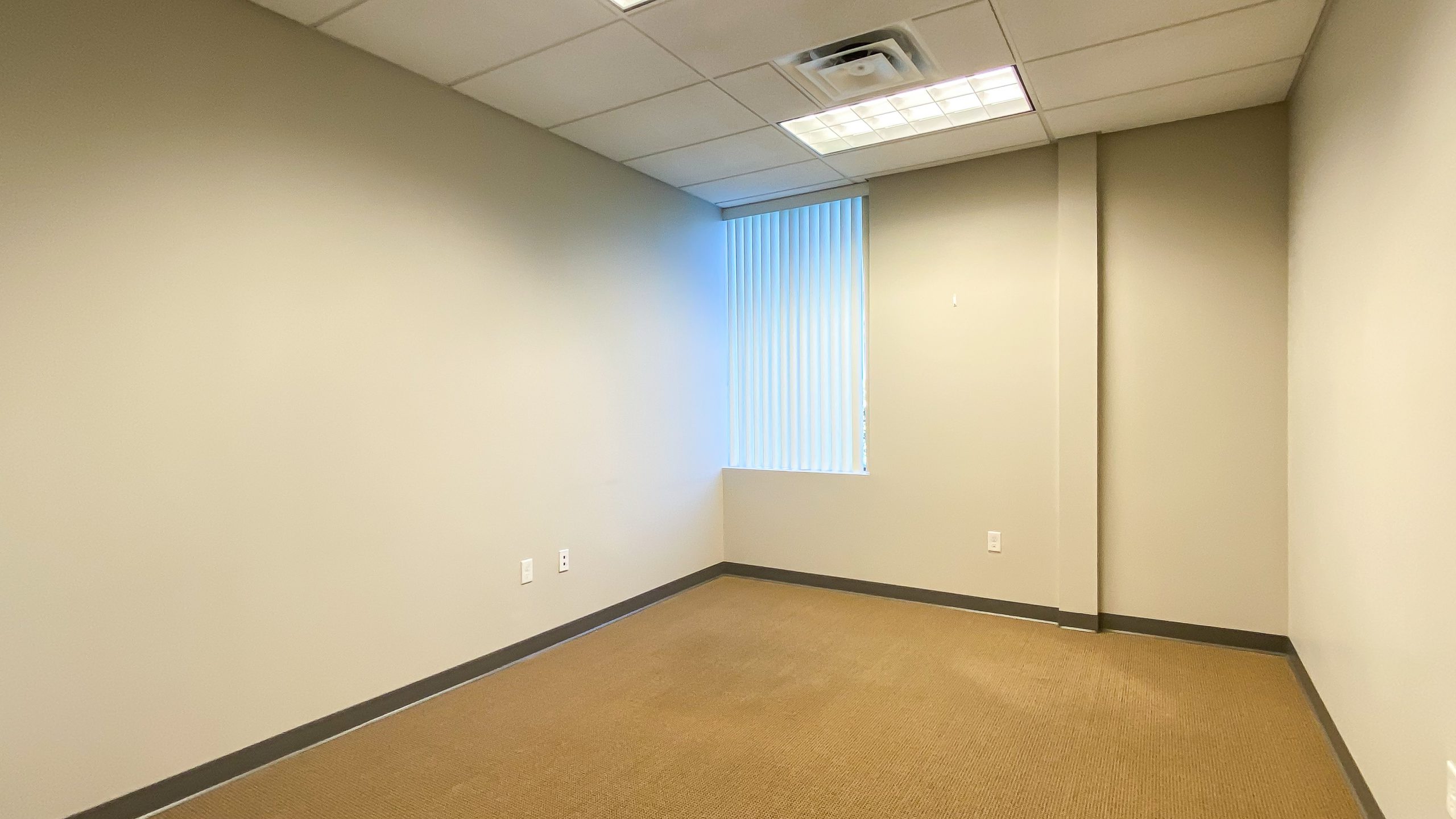 The interior of an office unit for lease.